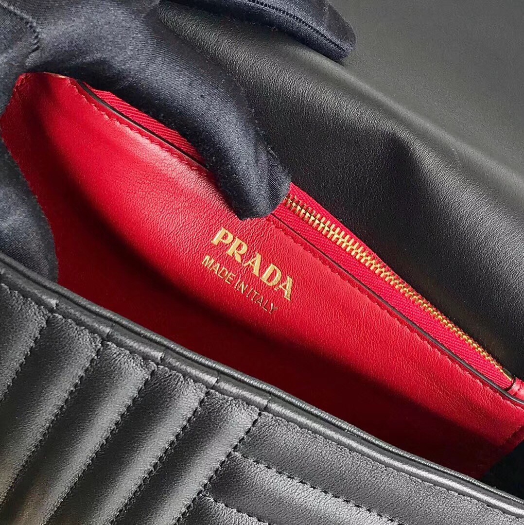 Pra*a medium diagramme flap bag in black calfskin