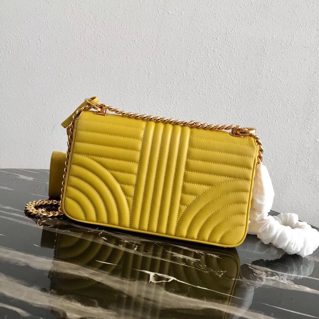 Pra*a medium diagramme flap bag in yellow calfskin