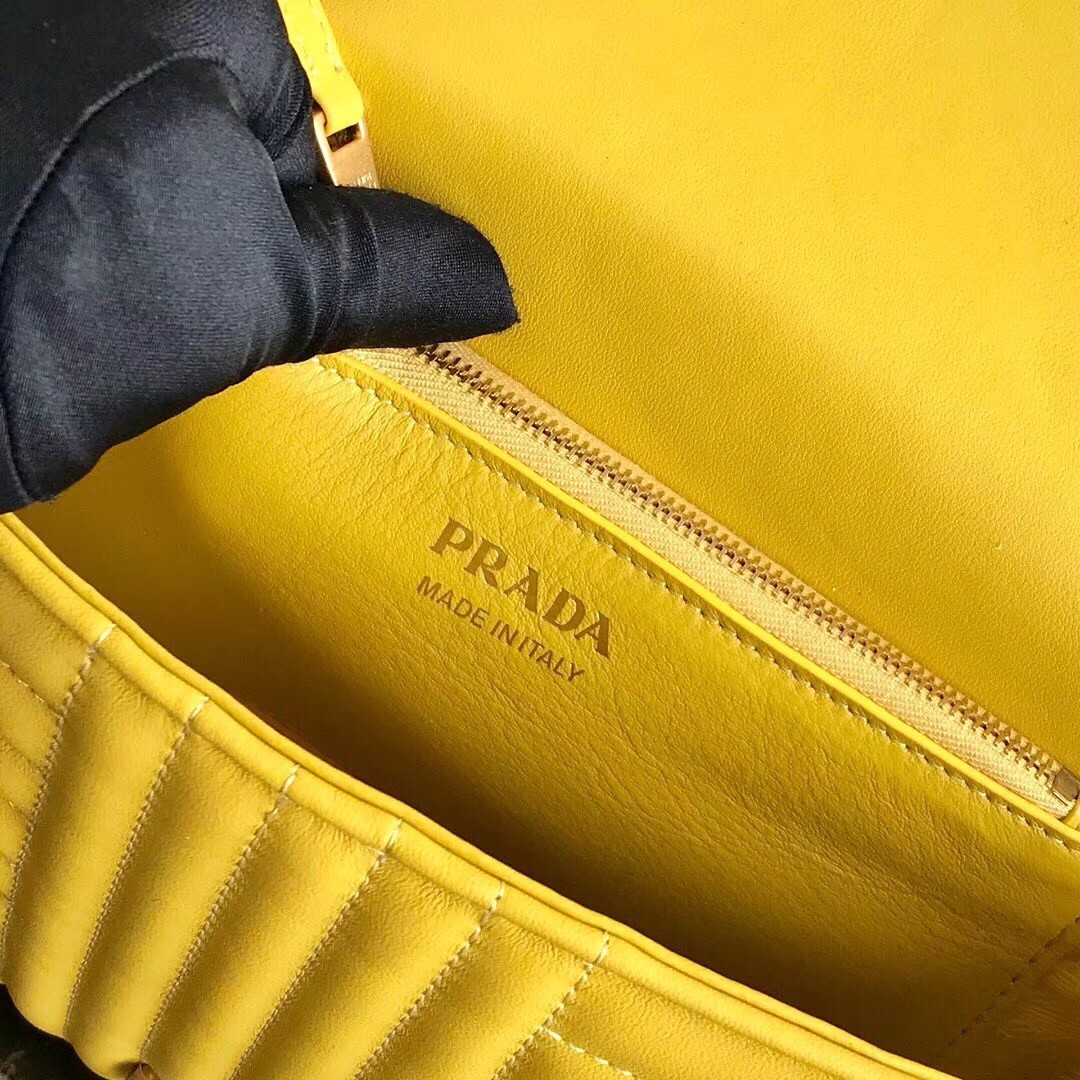 Pra*a medium diagramme flap bag in yellow calfskin