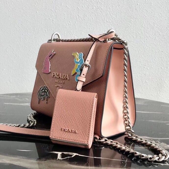 Pra*a nude monochrome flap bag with metal appliques
