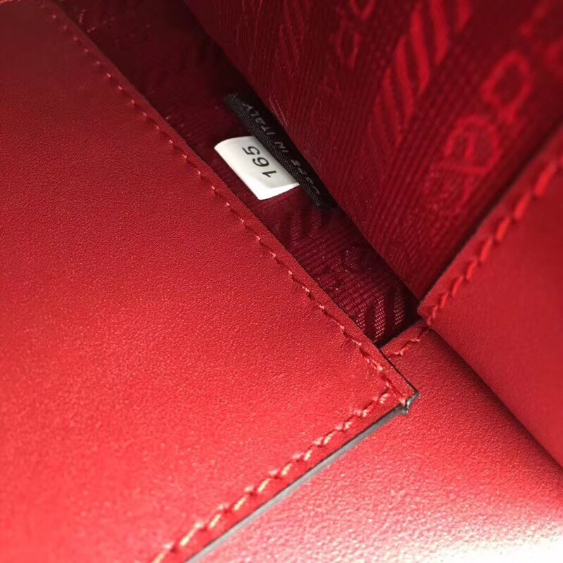 Pra*a monochrome flap bag in red saffiano leather