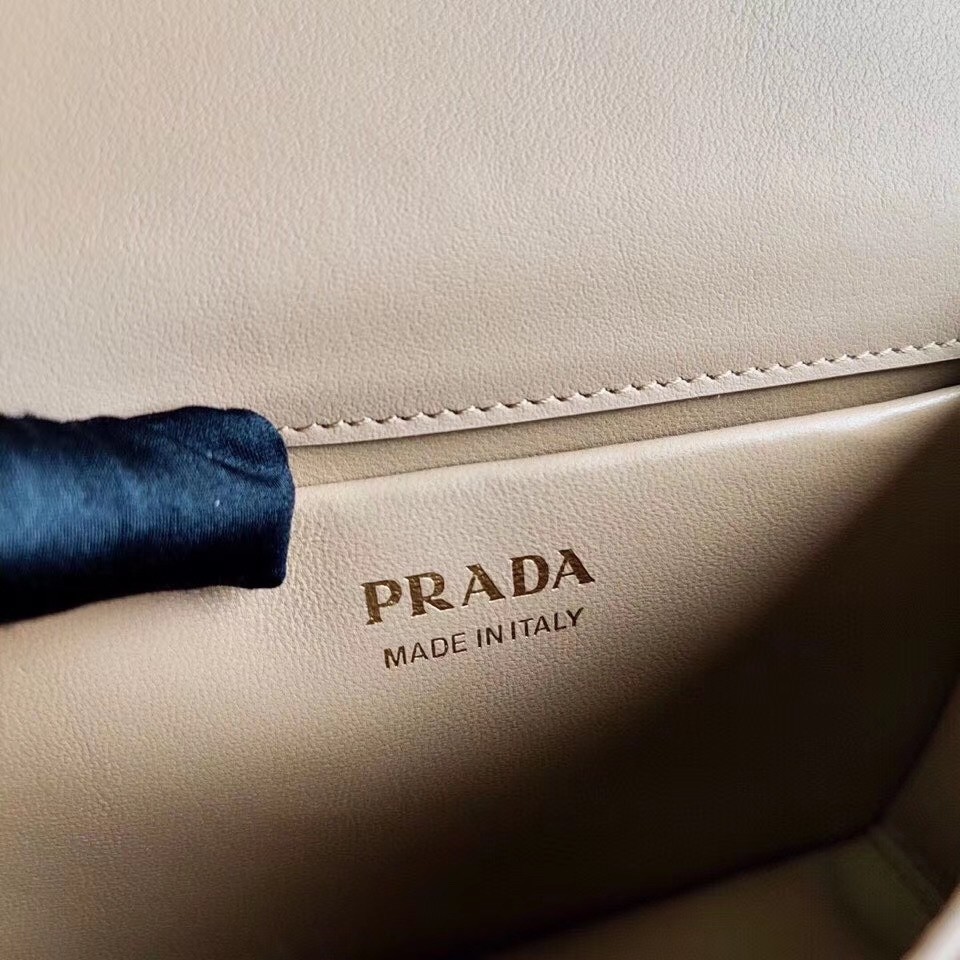 Pra*a symbole shoulder bag in beige saffiano leather