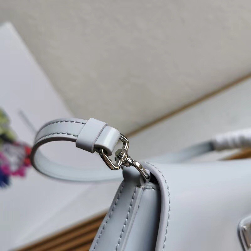 Pra*a cleo flap bag in cornflower blue brushed leather