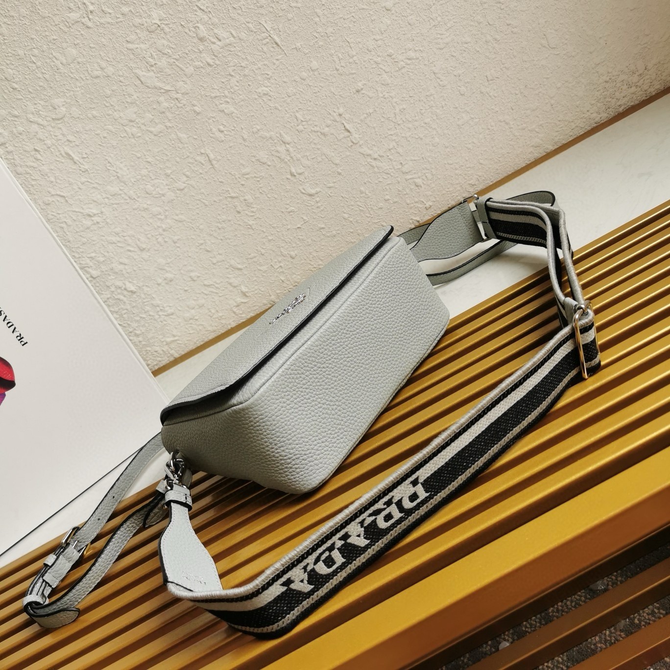Pra*a flap shoulder bag in cornflower grained leather