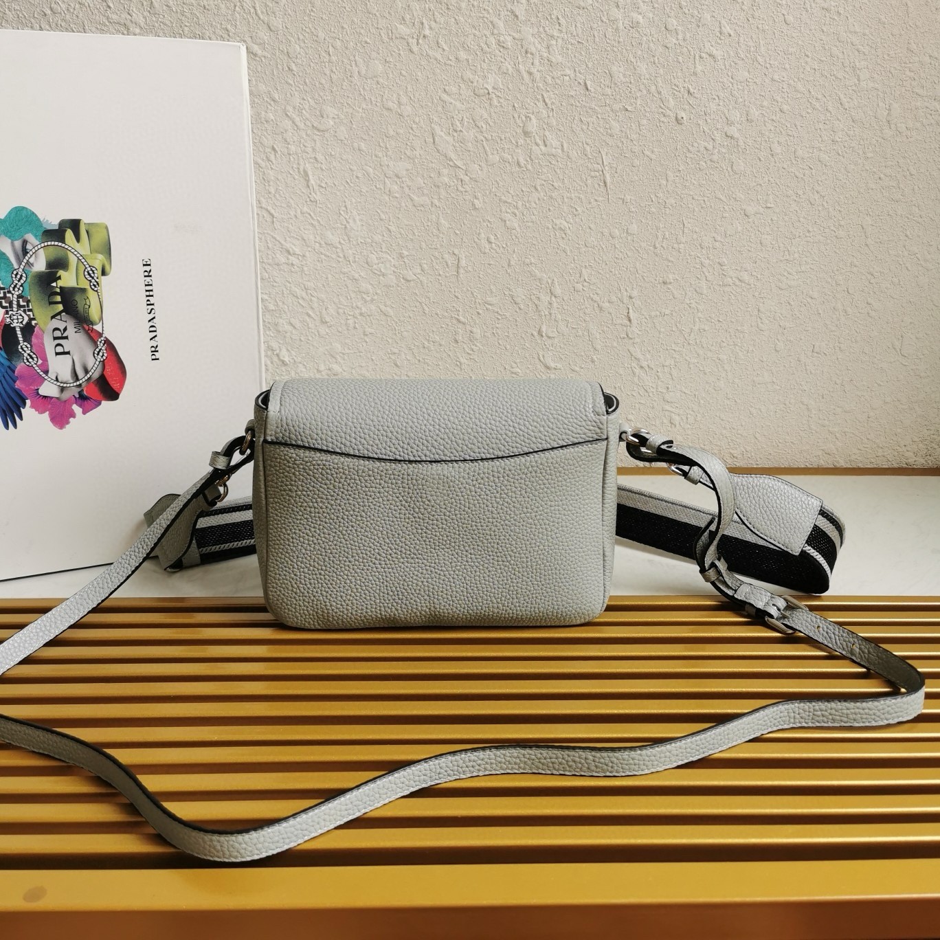 Pra*a flap shoulder bag in cornflower grained leather
