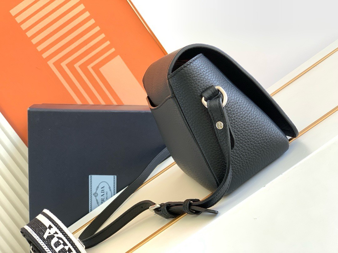 Pra*a flap shoulder bag in black grained leather