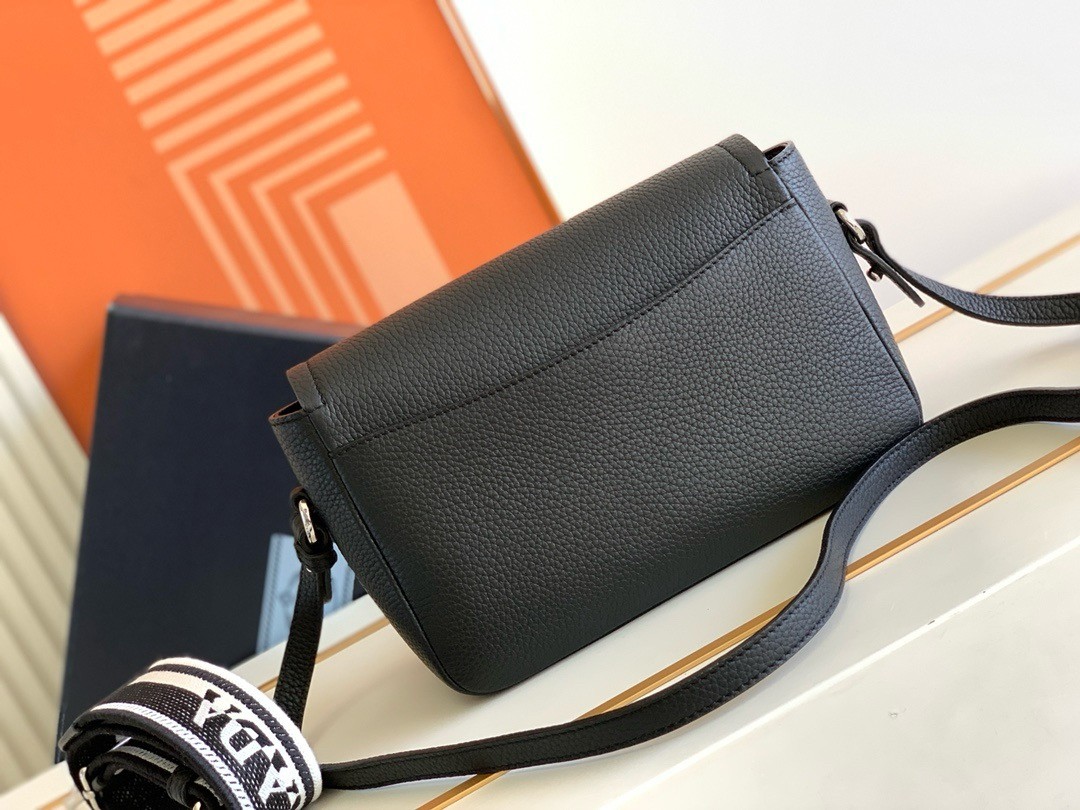 Pra*a flap shoulder bag in black grained leather