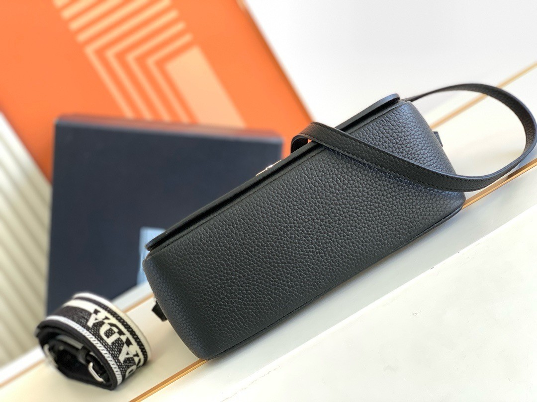 Pra*a flap shoulder bag in black grained leather
