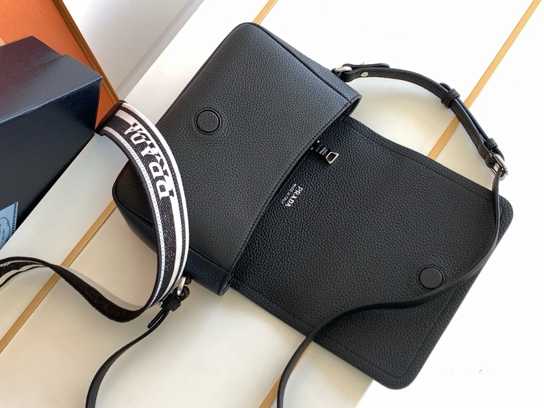 Pra*a flap shoulder bag in black grained leather