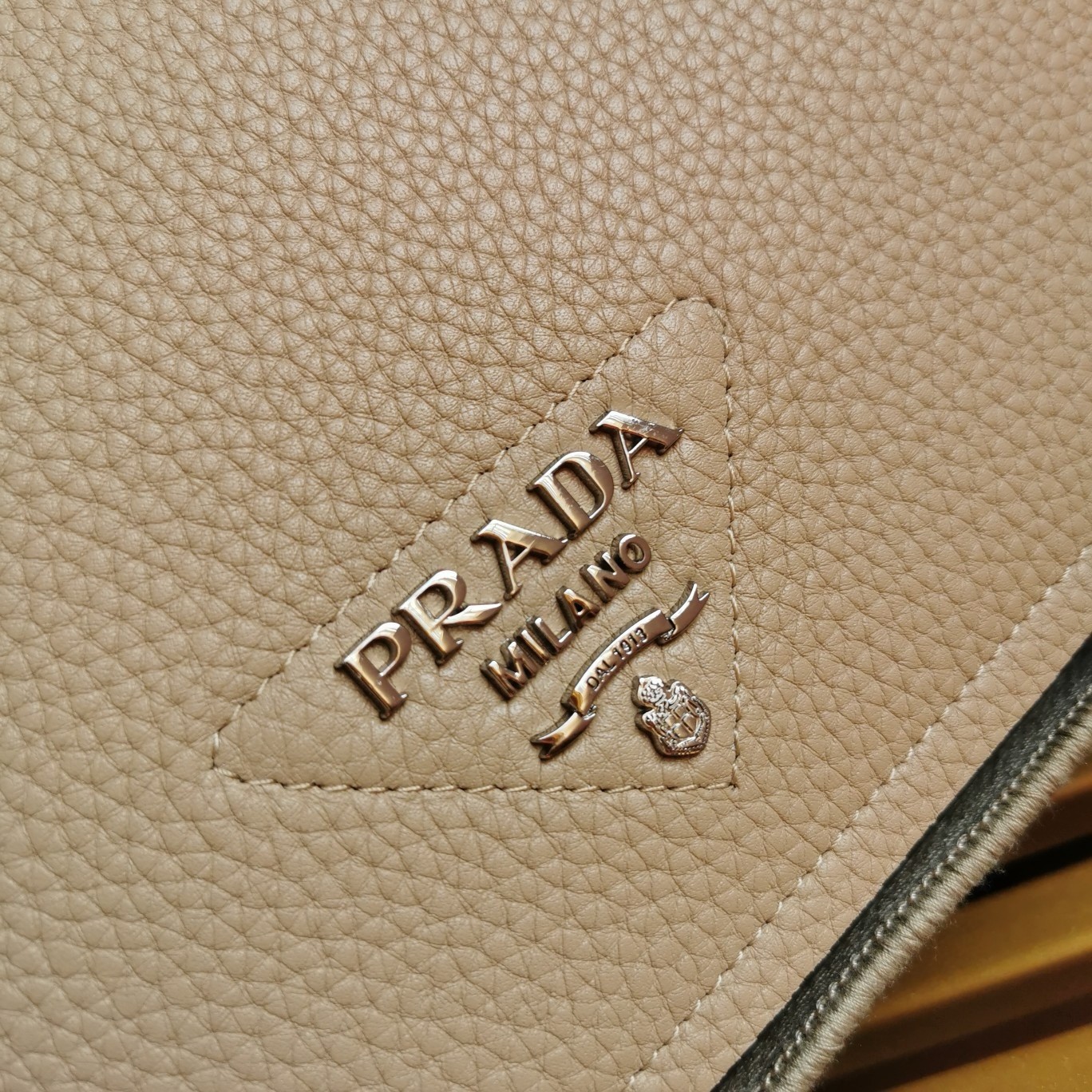 Pra*a flap shoulder bag in sand grained leather
