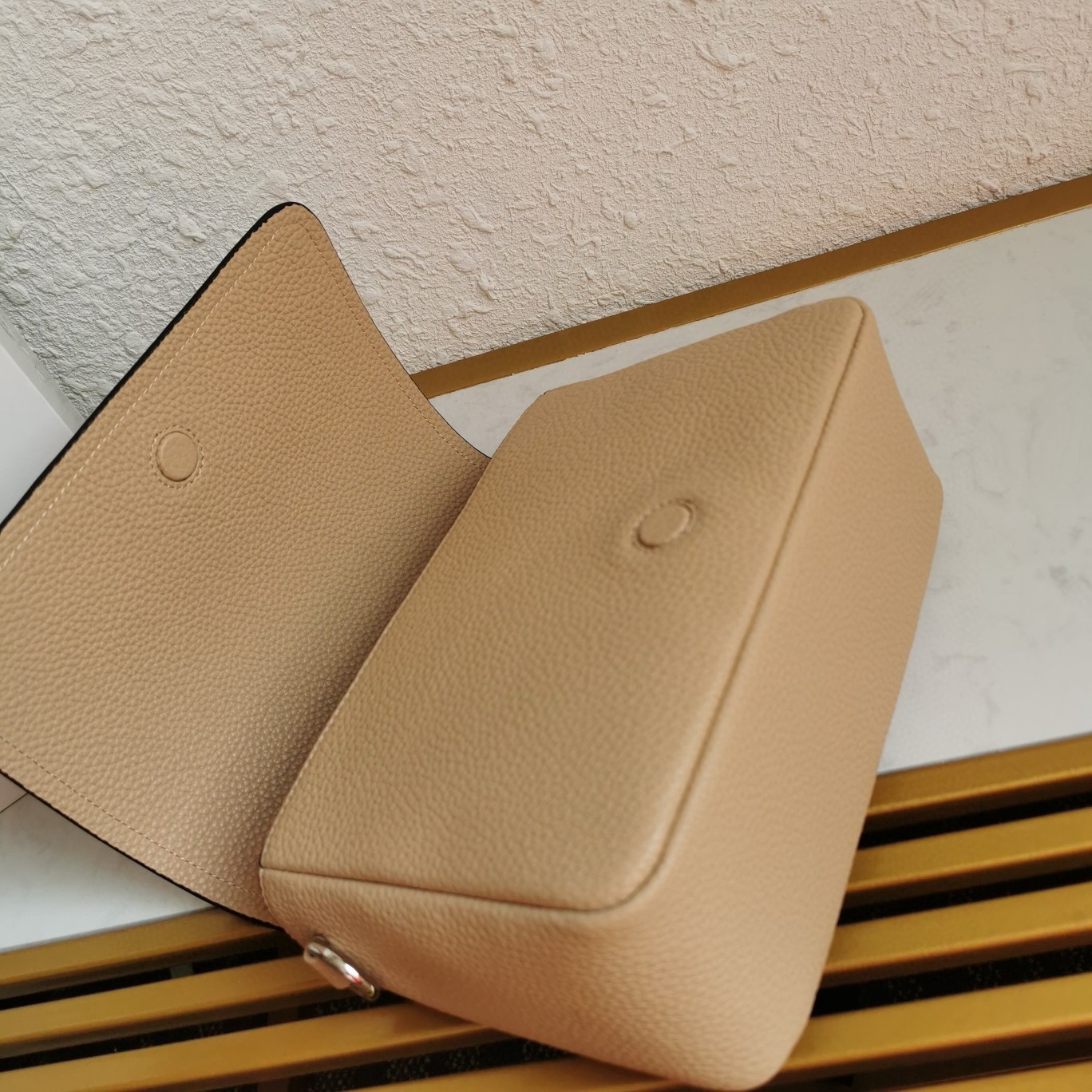 Pra*a flap shoulder bag in sand grained leather