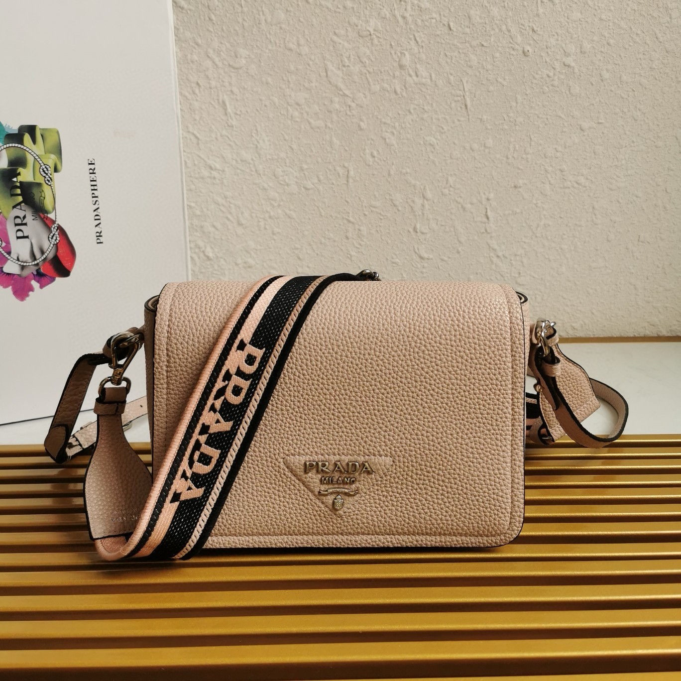 Pra*a flap shoulder bag in light pink grained leather