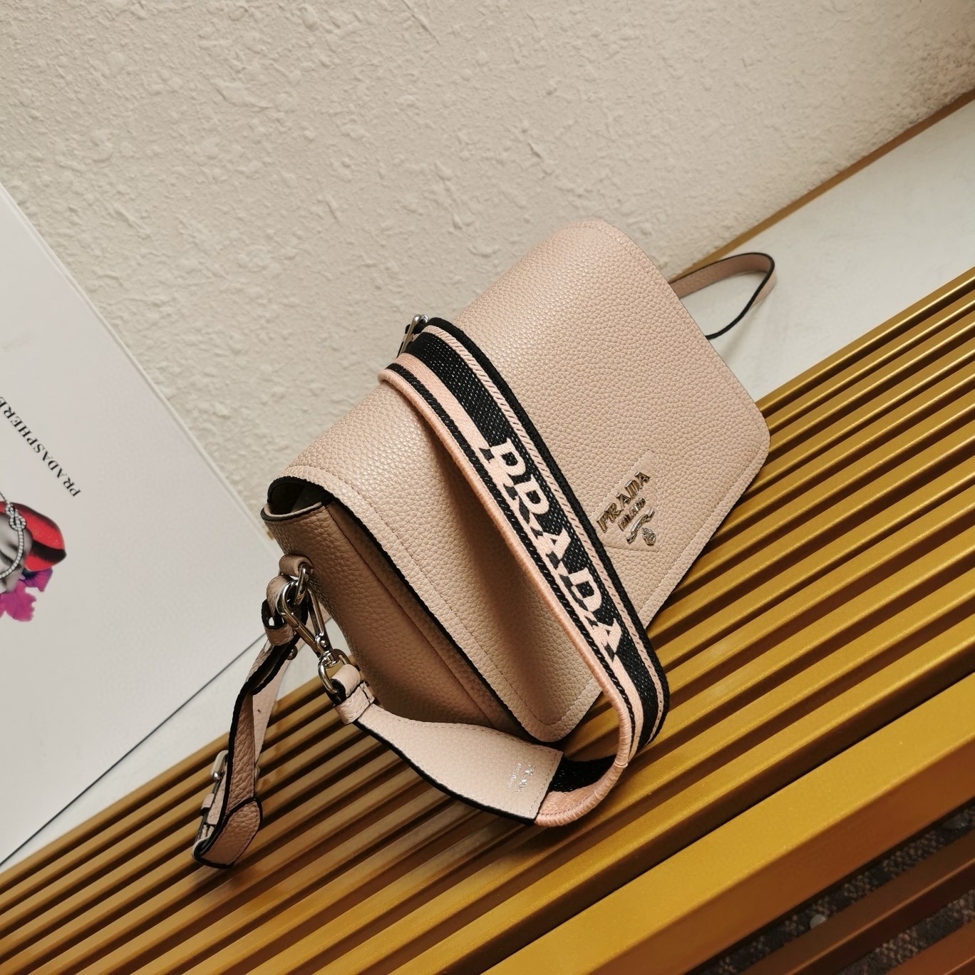 Pra*a flap shoulder bag in light pink grained leather