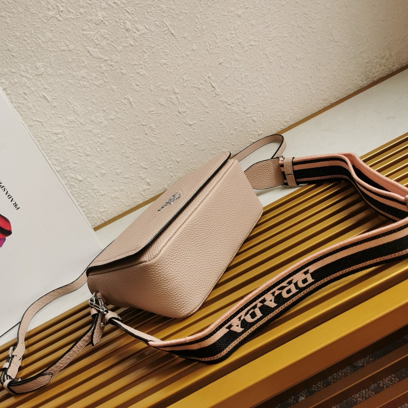 Pra*a flap shoulder bag in light pink grained leather