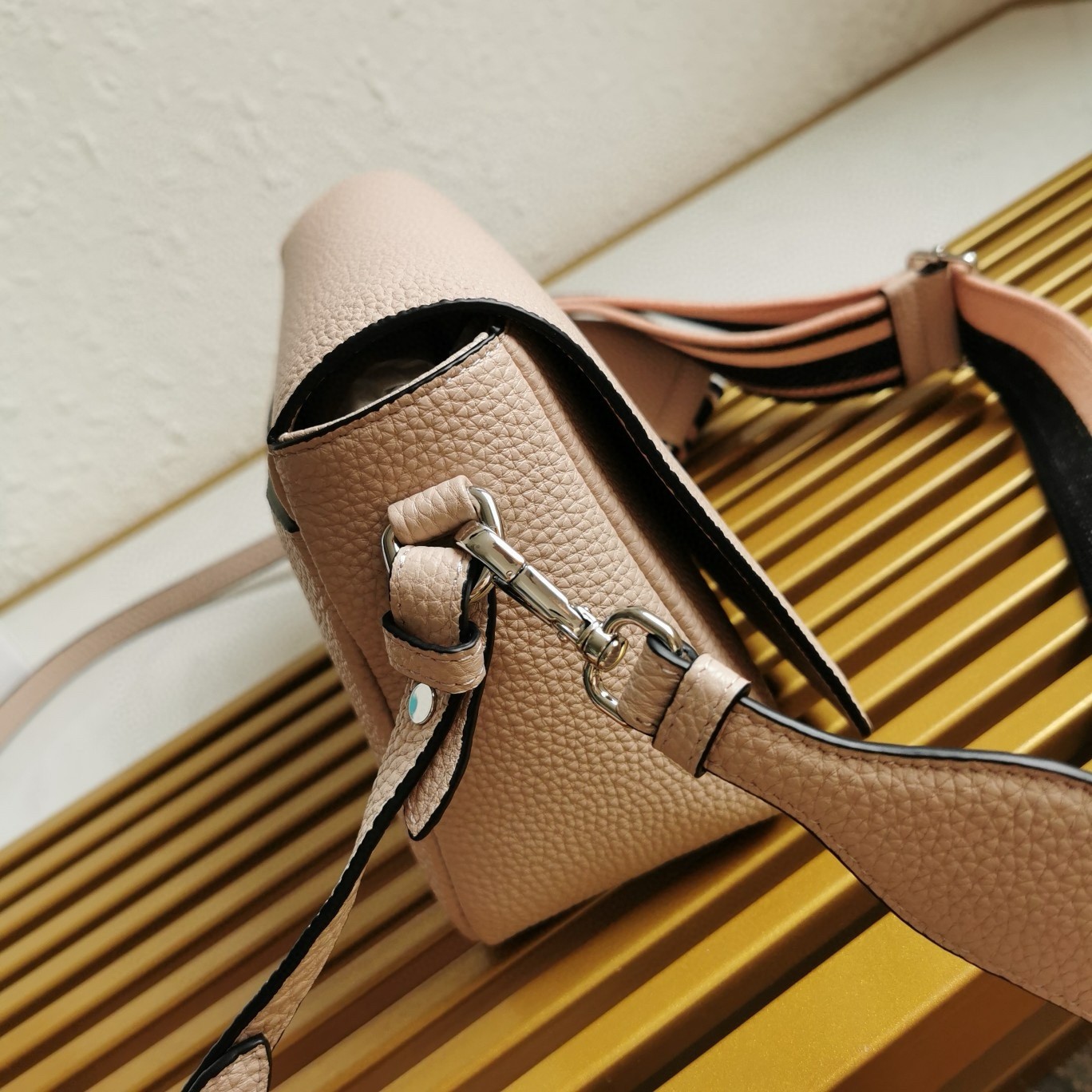 Pra*a flap shoulder bag in light pink grained leather