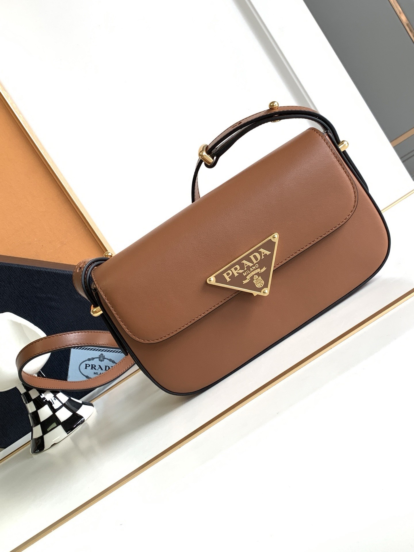Pra*a shoulder bag in cognac smooth calfskin