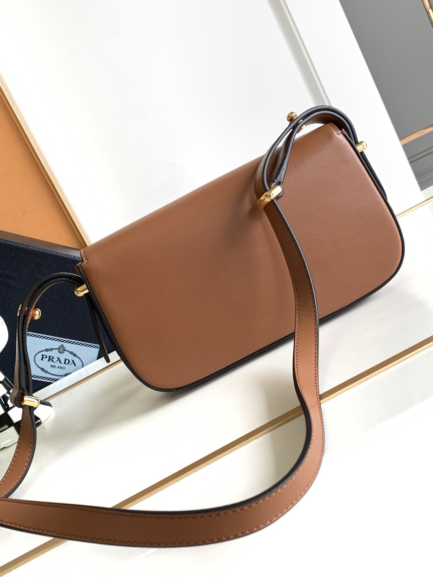 Pra*a shoulder bag in cognac smooth calfskin