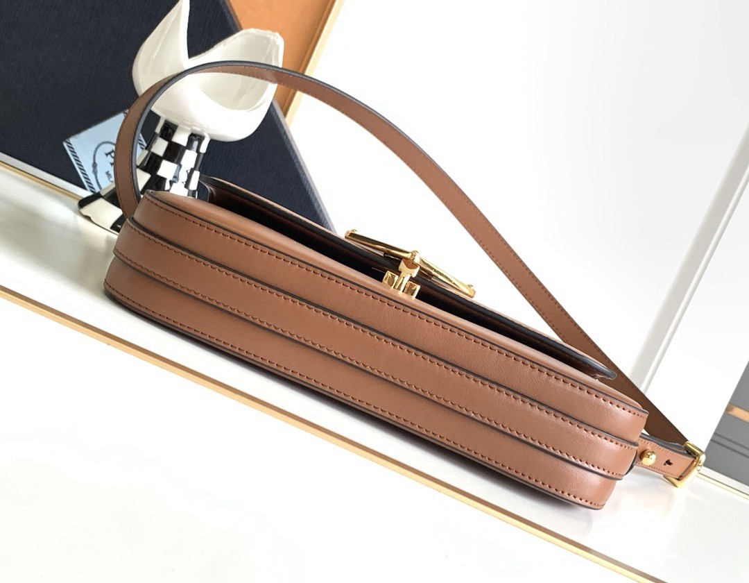Pra*a shoulder bag in cognac smooth calfskin