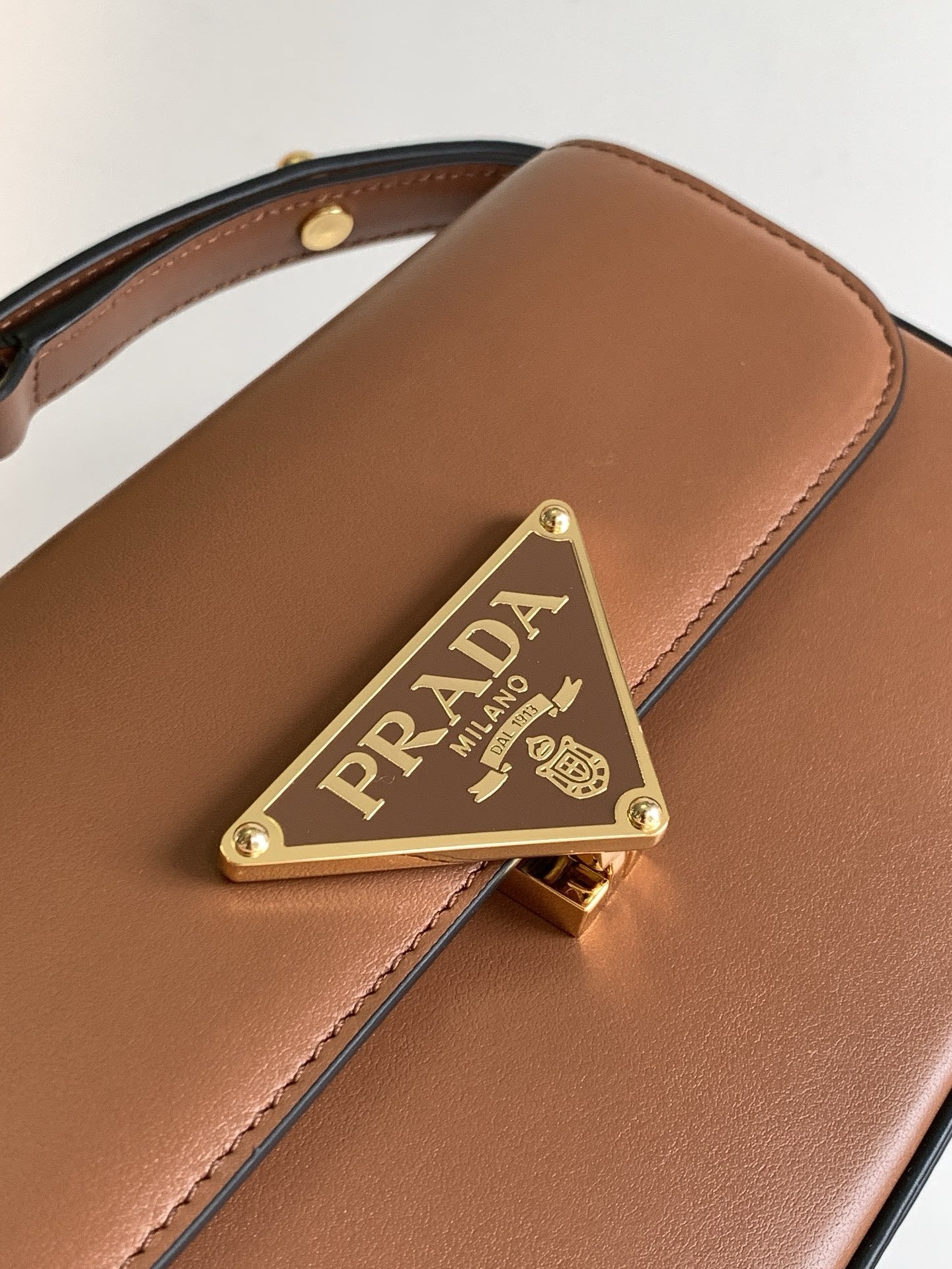 Pra*a shoulder bag in cognac smooth calfskin