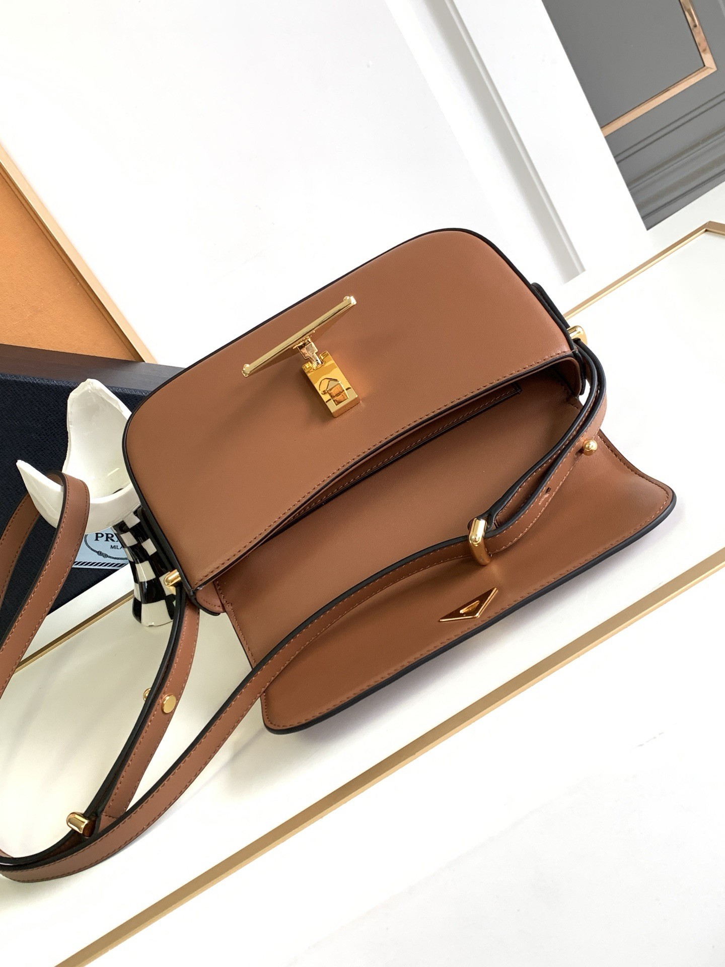 Pra*a shoulder bag in cognac smooth calfskin