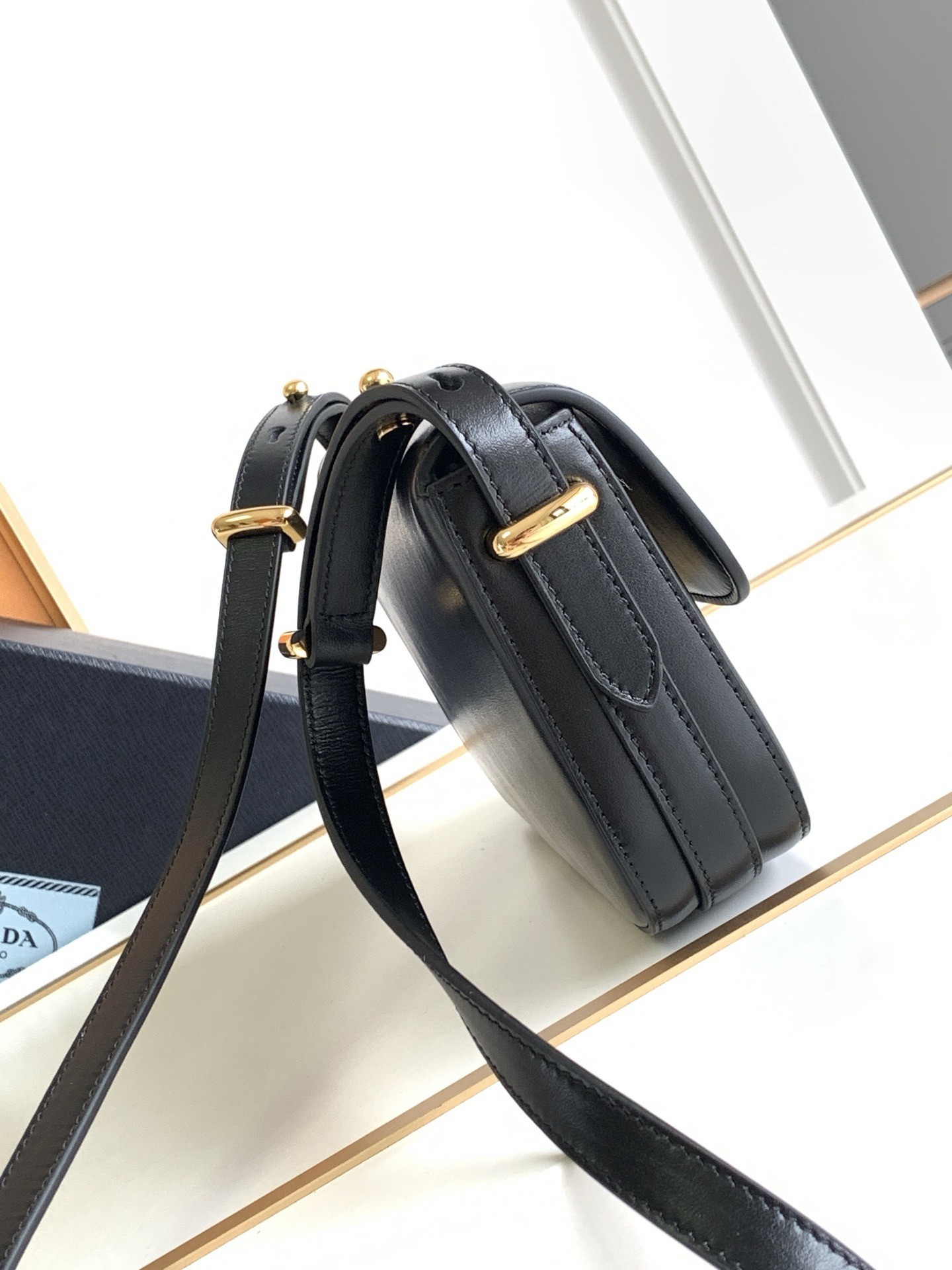 Pra*a shoulder bag in black smooth calfskin