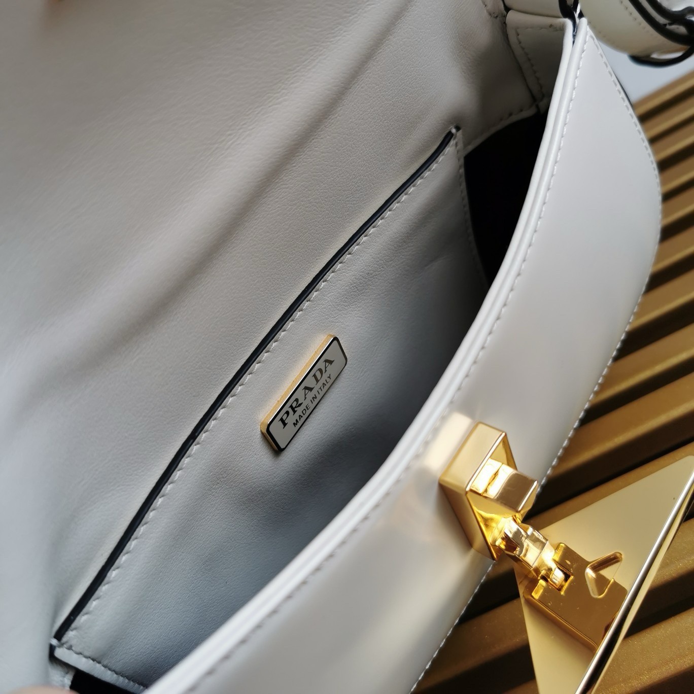 Pra*a shoulder bag in white brushed calfskin
