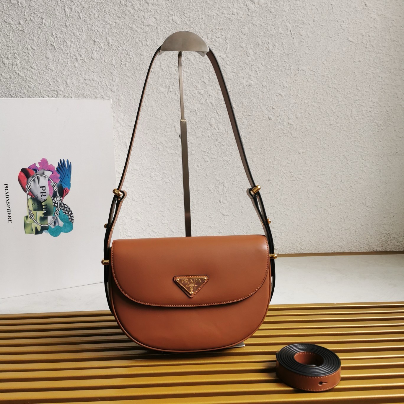 Pra*a arque shoulder bag with flap in brown leather