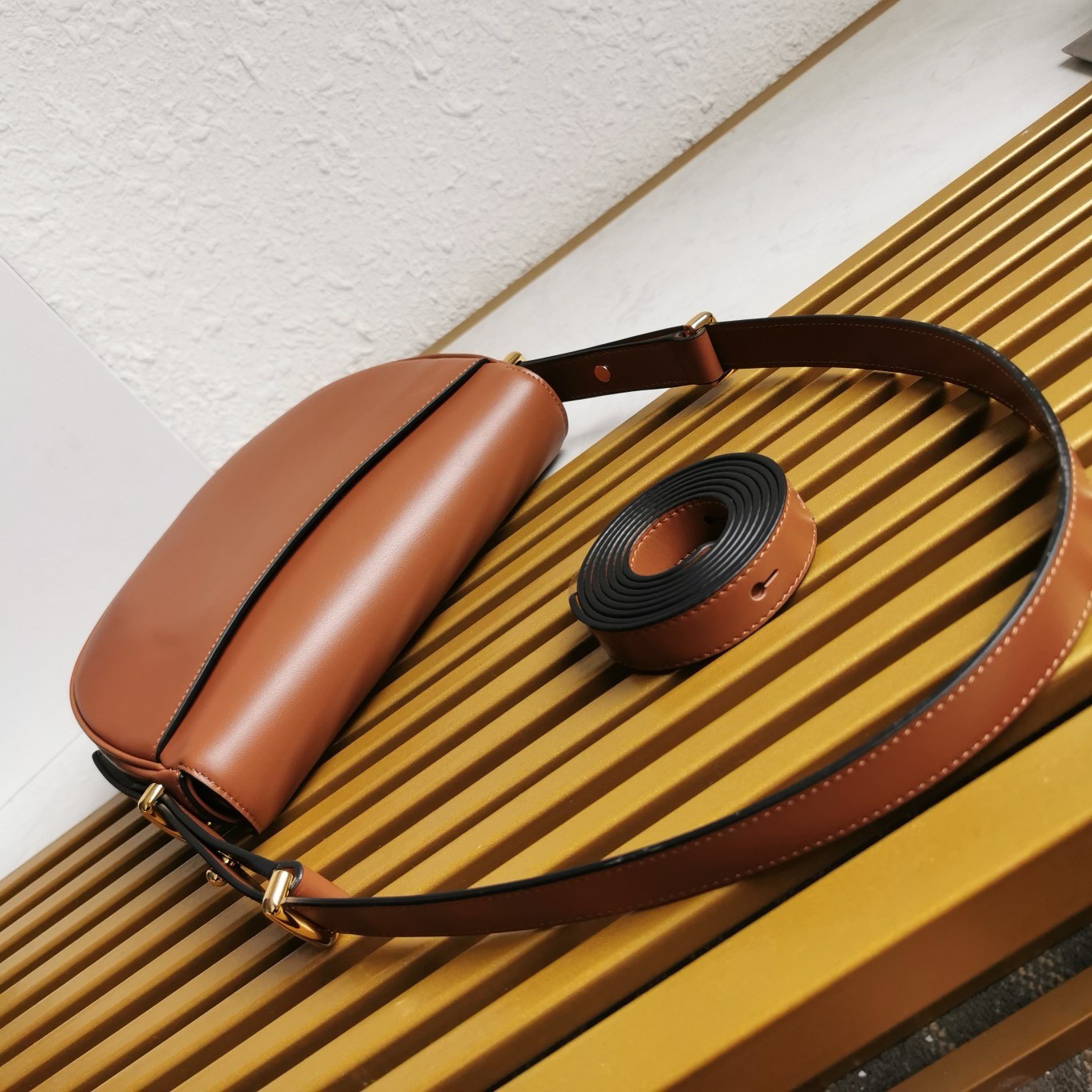 Pra*a arque shoulder bag with flap in brown leather