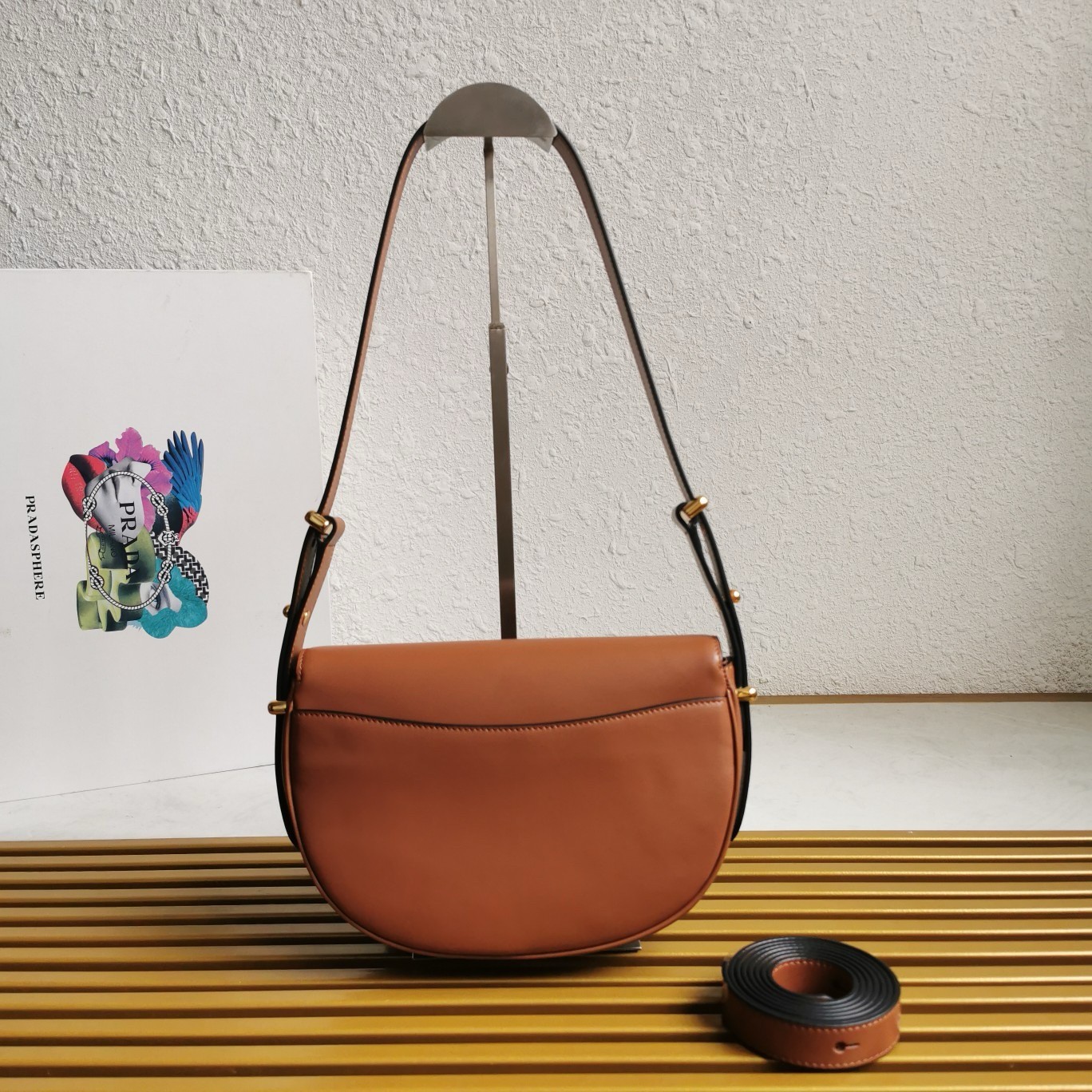 Pra*a arque shoulder bag with flap in brown leather