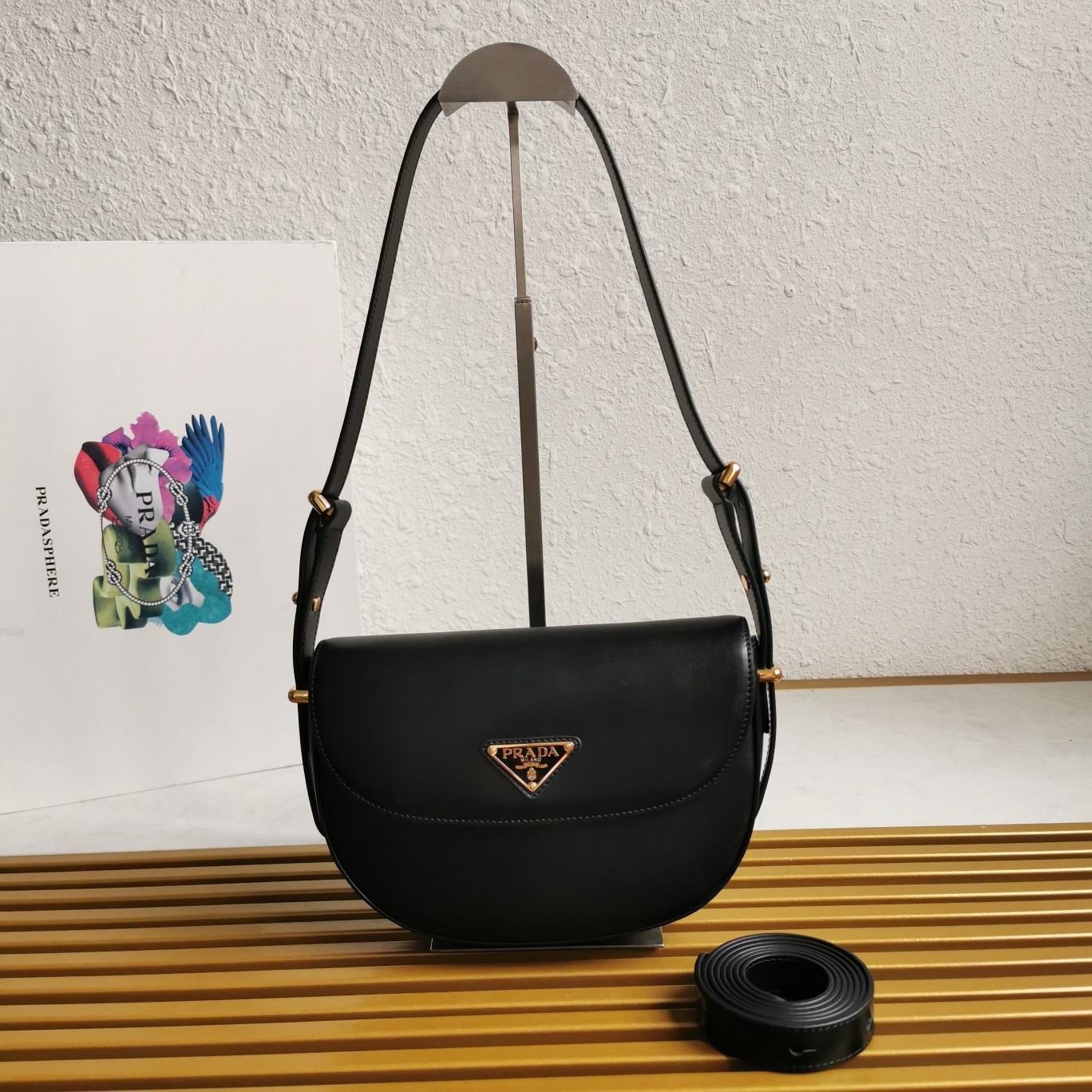 Pra*a arque shoulder bag with flap in black leather