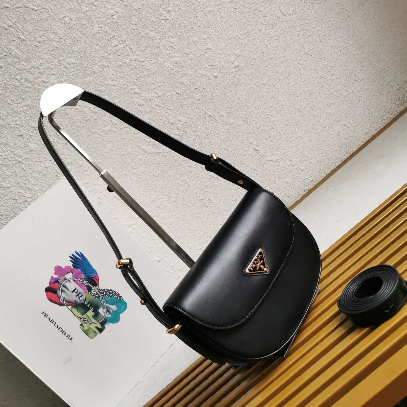 Pra*a arque shoulder bag with flap in black leather