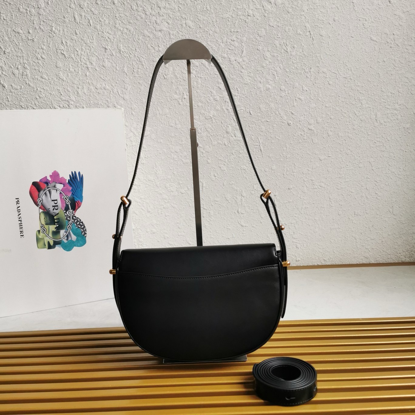 Pra*a arque shoulder bag with flap in black leather