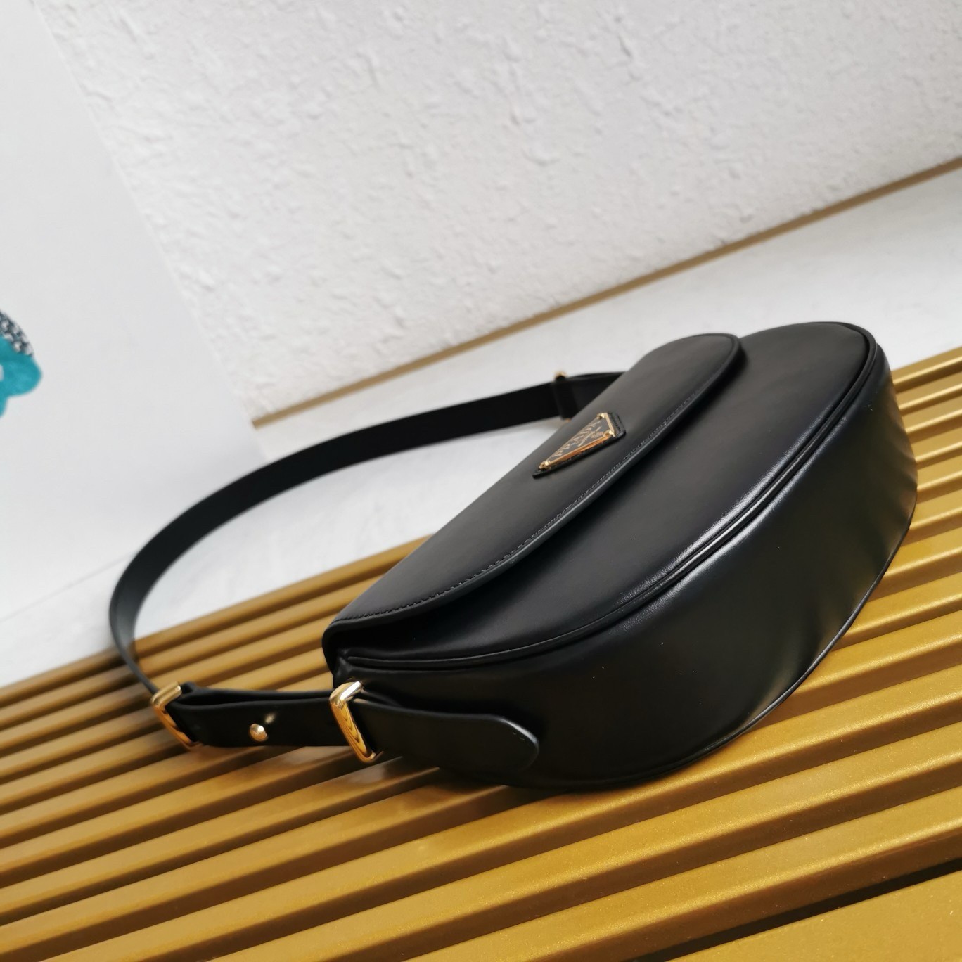 Pra*a arque shoulder bag with flap in black leather