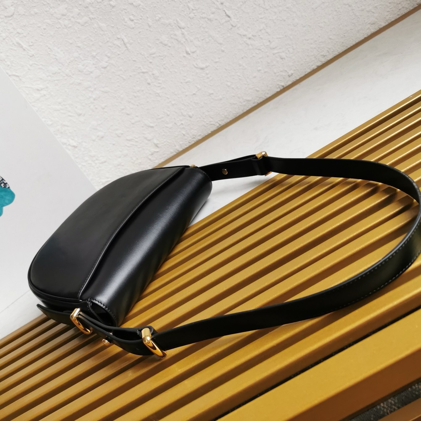 Pra*a arque shoulder bag with flap in black leather
