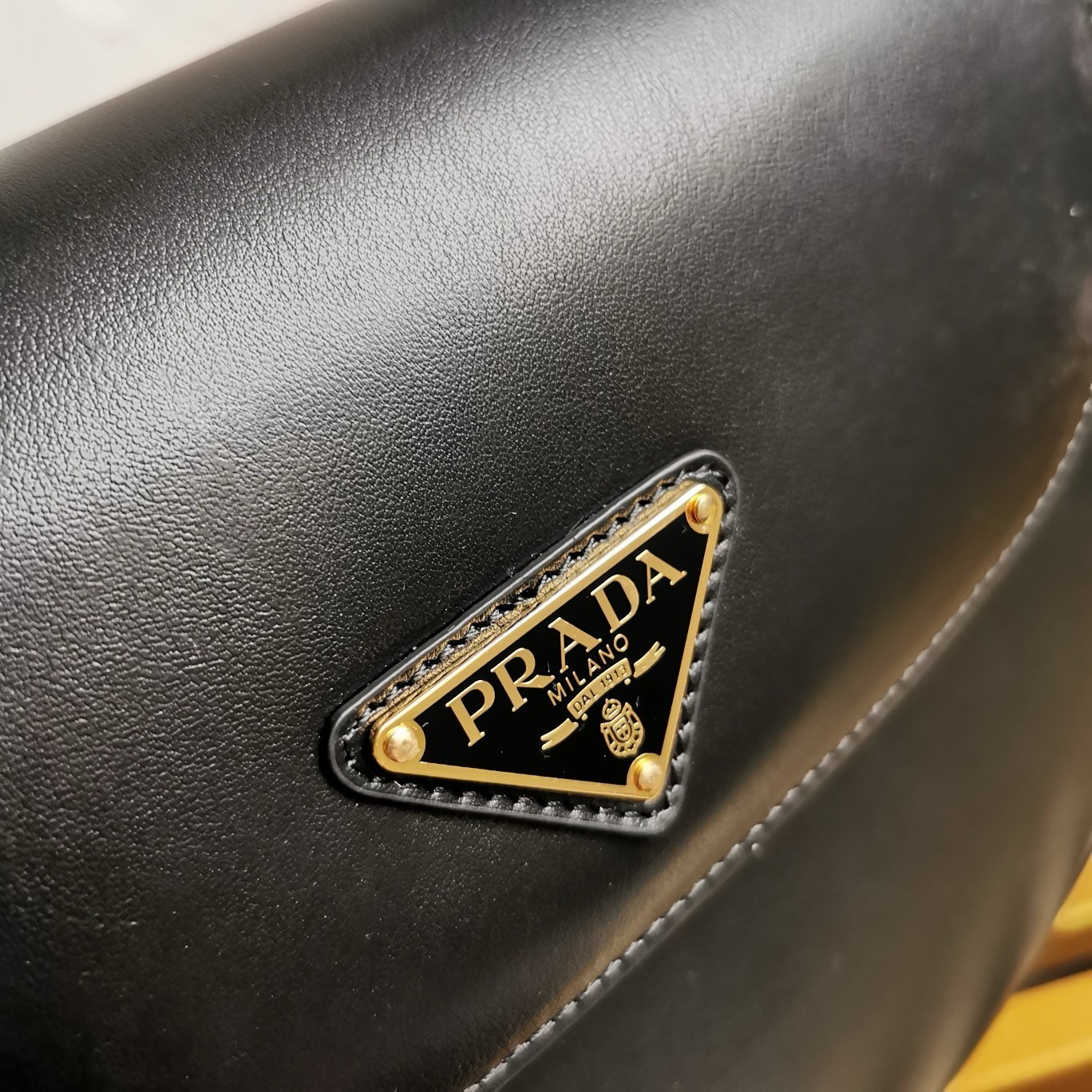 Pra*a arque shoulder bag with flap in black leather