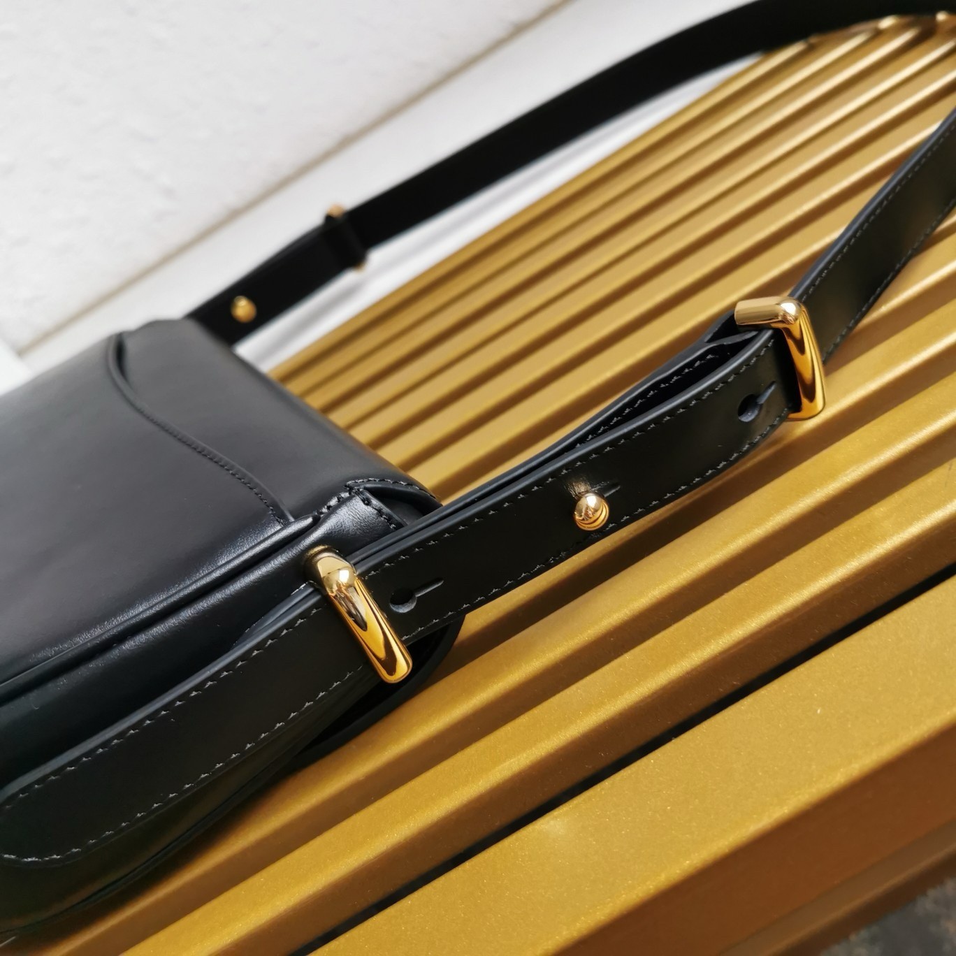 Pra*a arque shoulder bag with flap in black leather