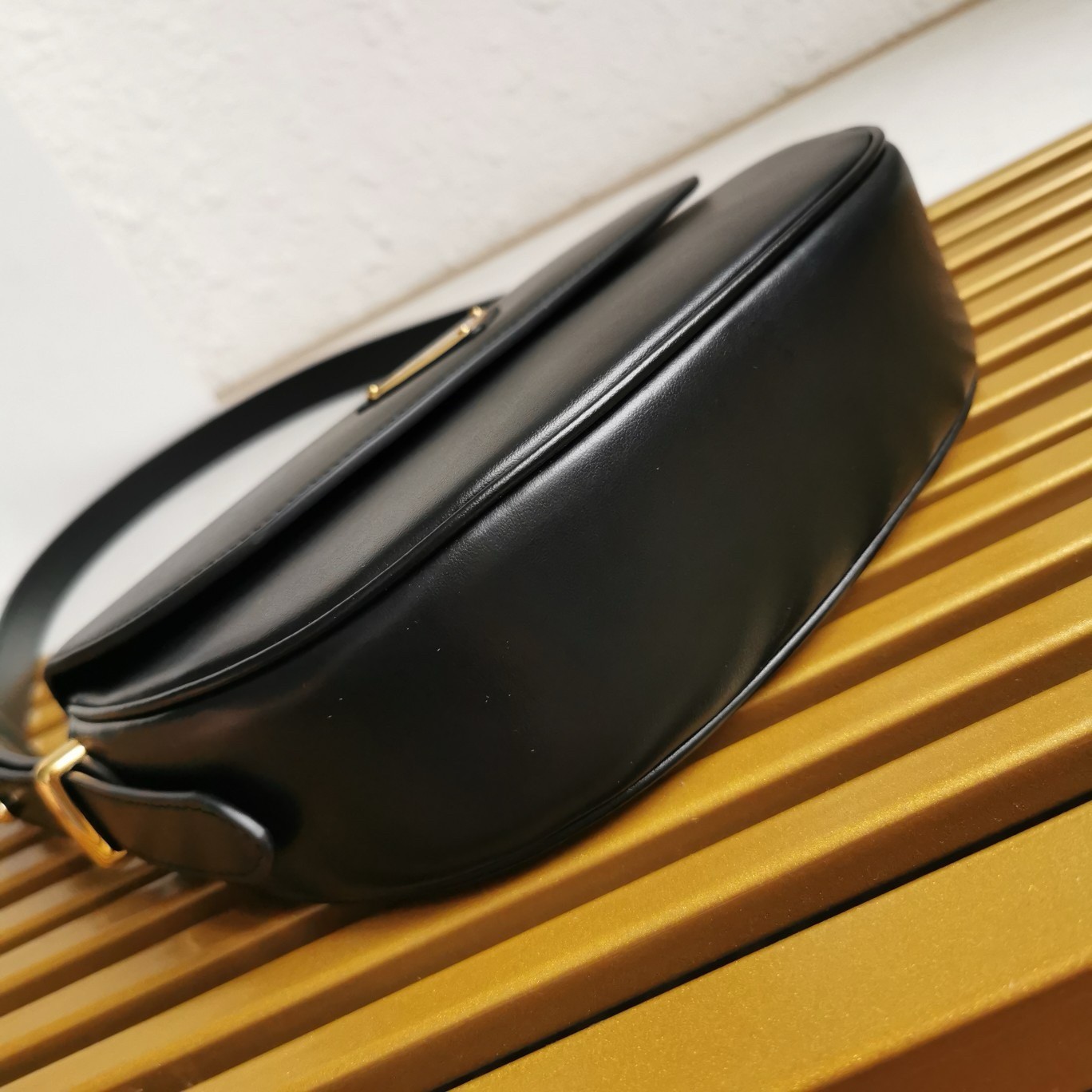 Pra*a arque shoulder bag with flap in black leather