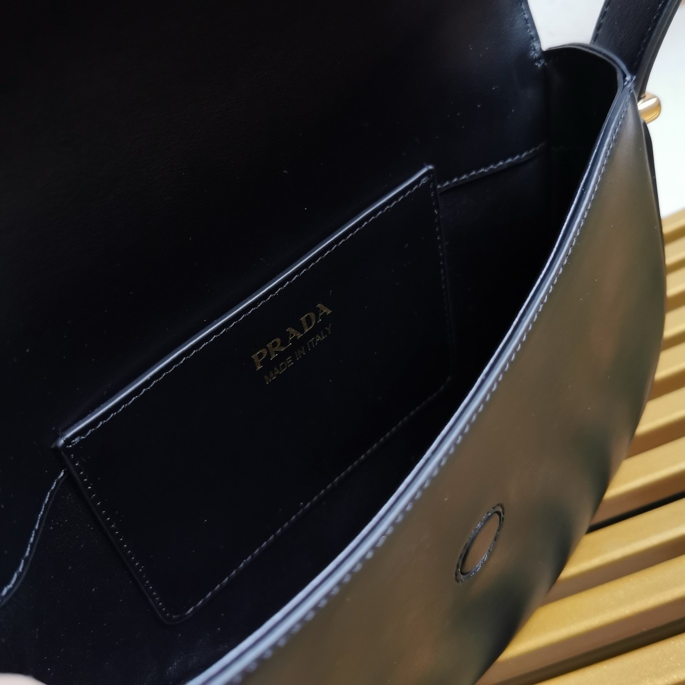 Pra*a arque shoulder bag with flap in black leather