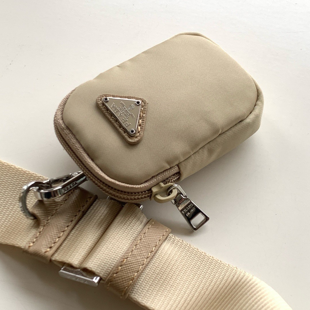 Pra*a shoulder bag with flap in beige re-nylon