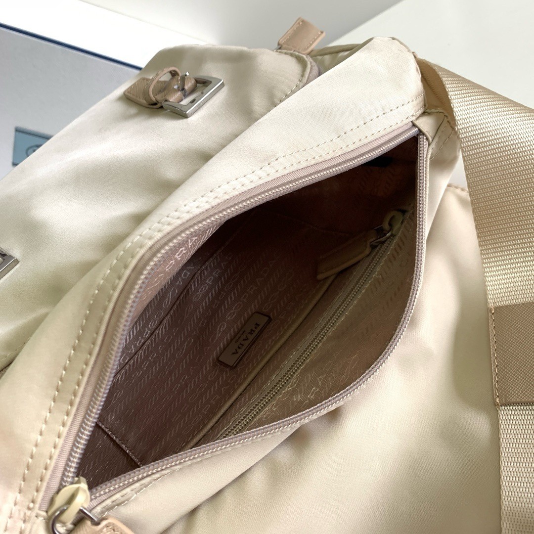 Pra*a shoulder bag with flap in beige re-nylon