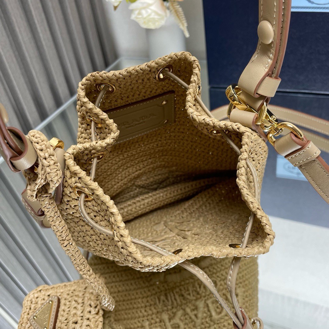 Pra*a crochet mini bucket bag in natural raffia-effect yarn
