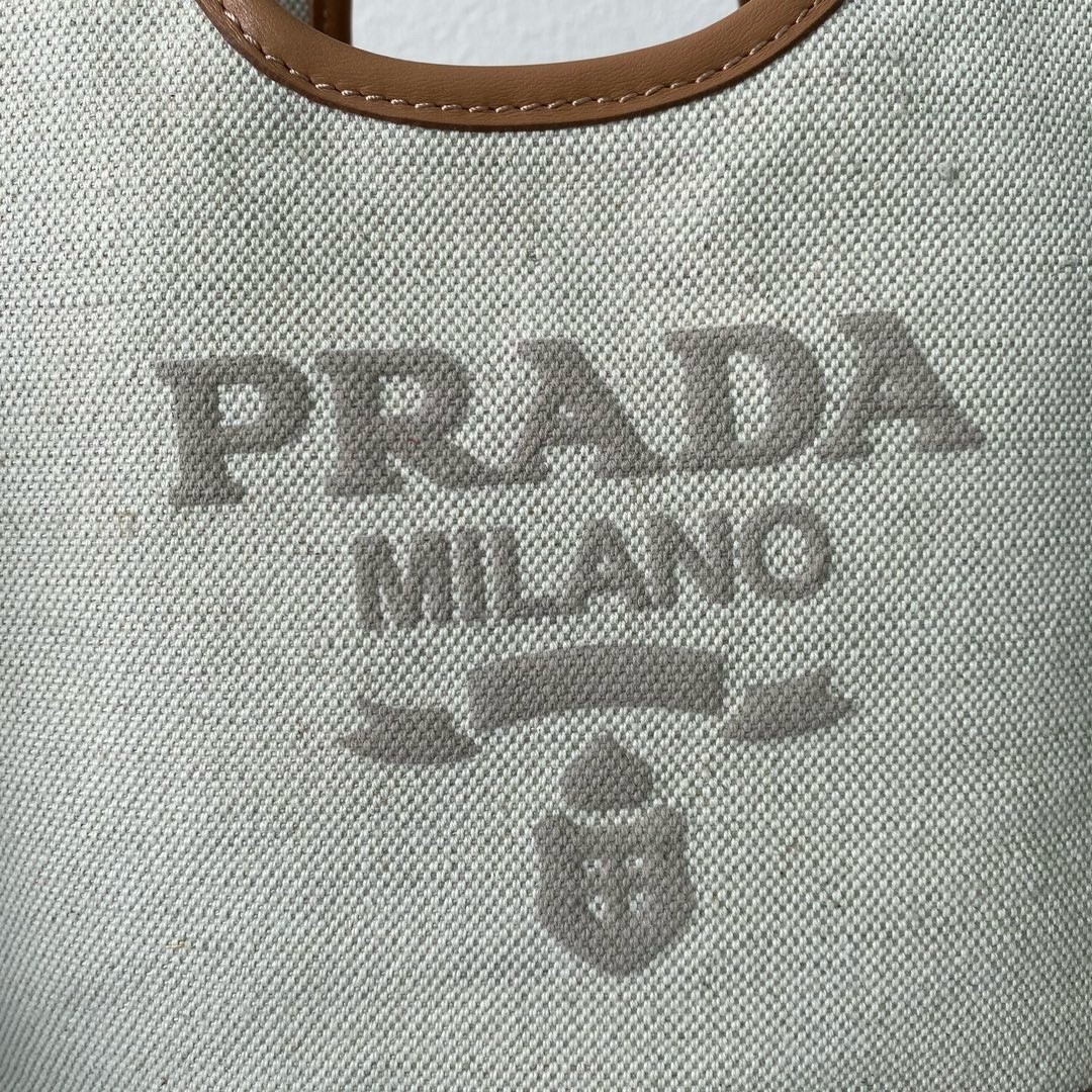 Pra*a mini buckle bag in linen blend and leather