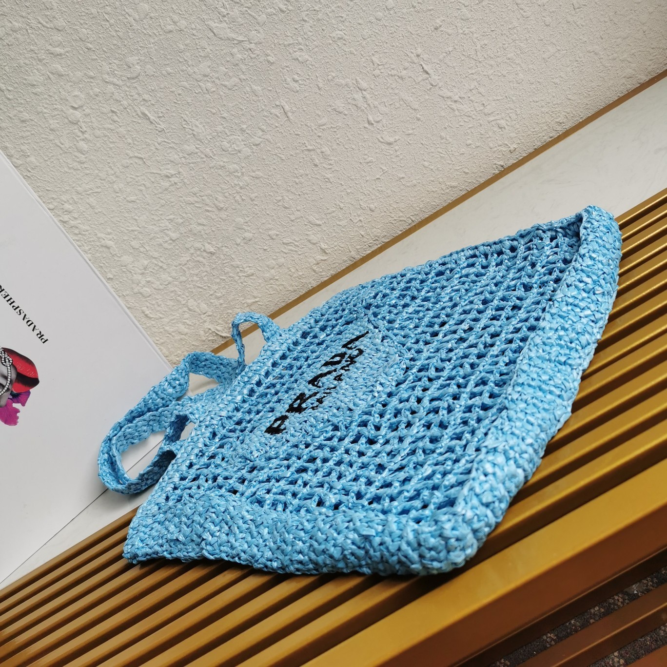 Pra*a small tote bag in blue woven raffia