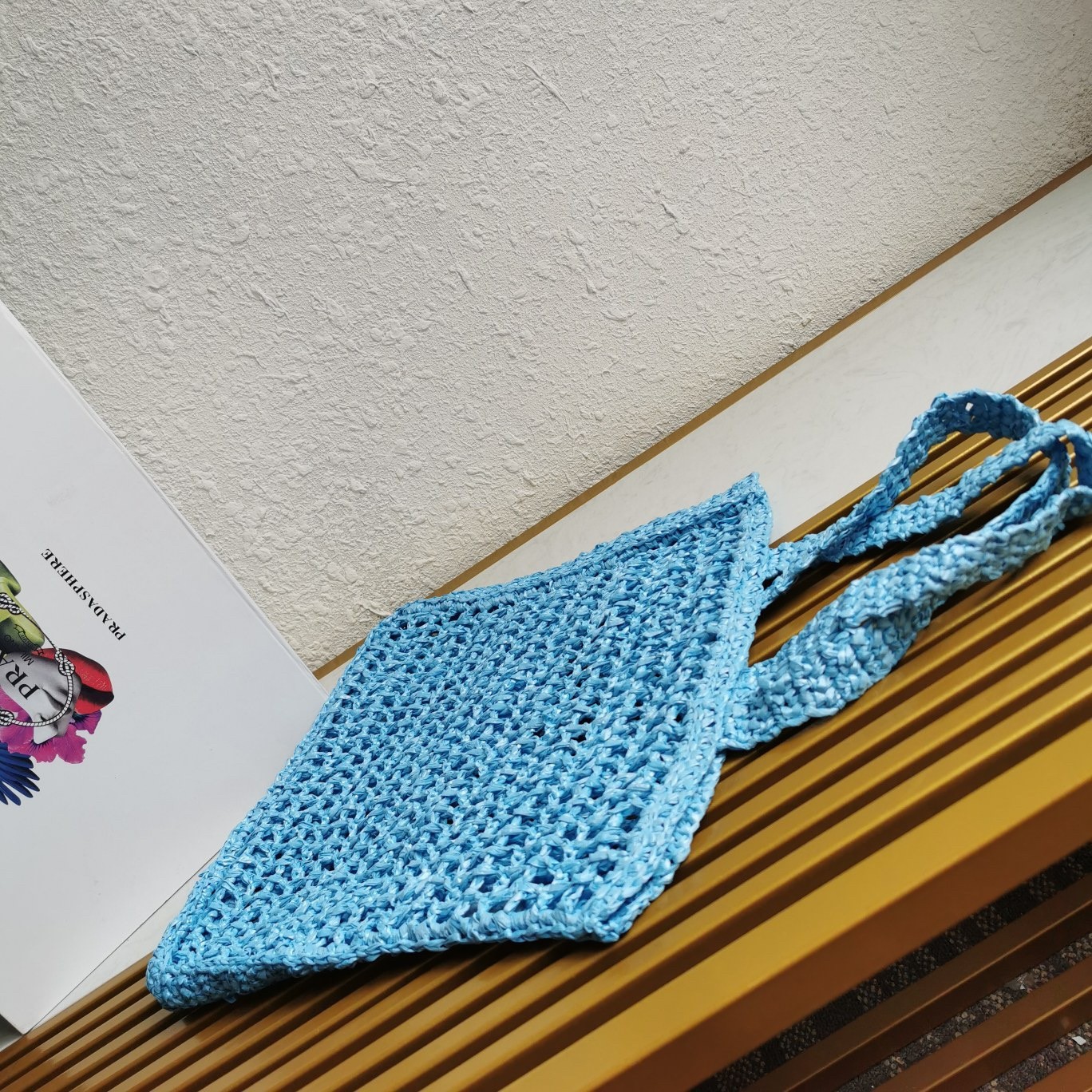 Pra*a small tote bag in blue woven raffia