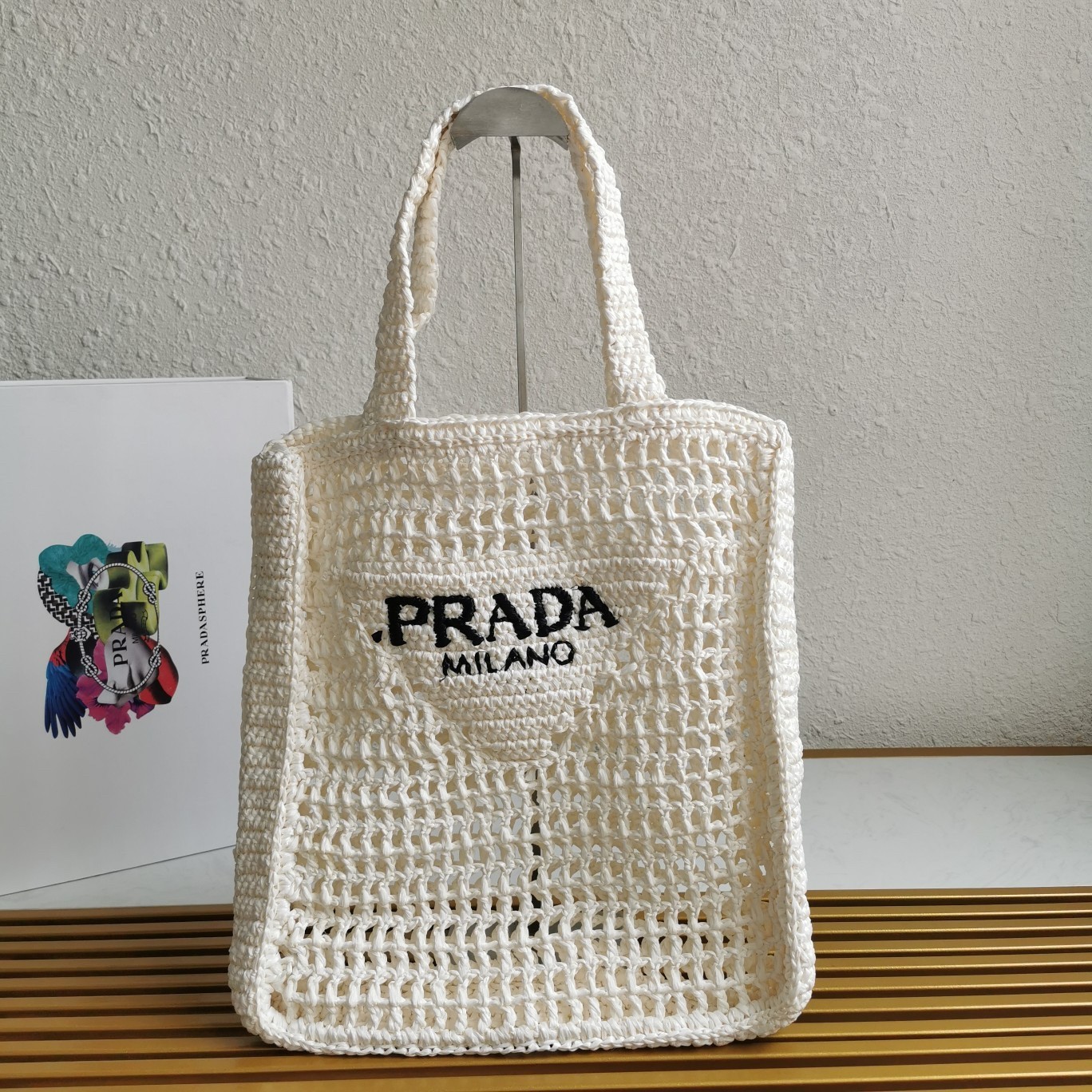 Pra*a small tote bag in white woven raffia