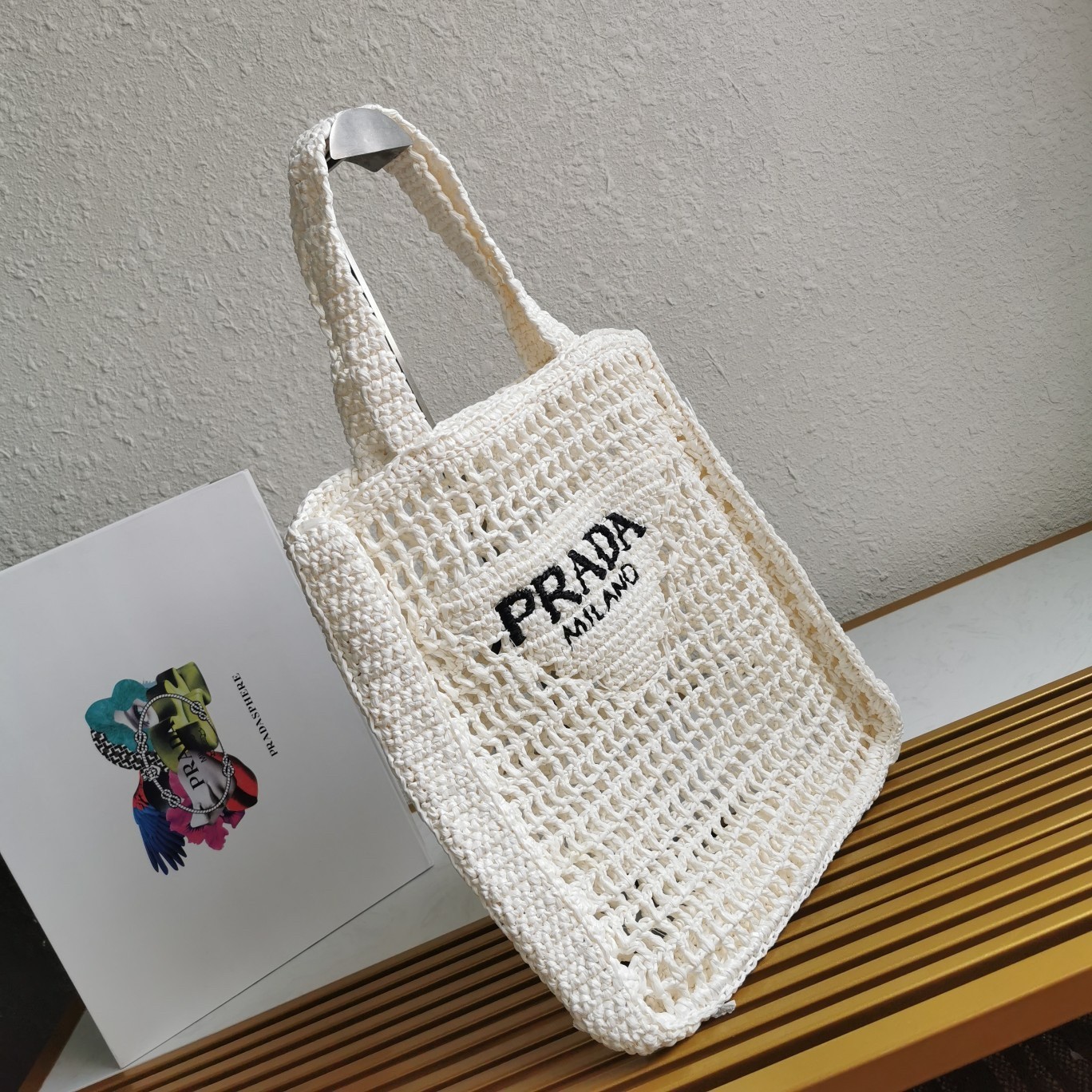 Pra*a small tote bag in white woven raffia