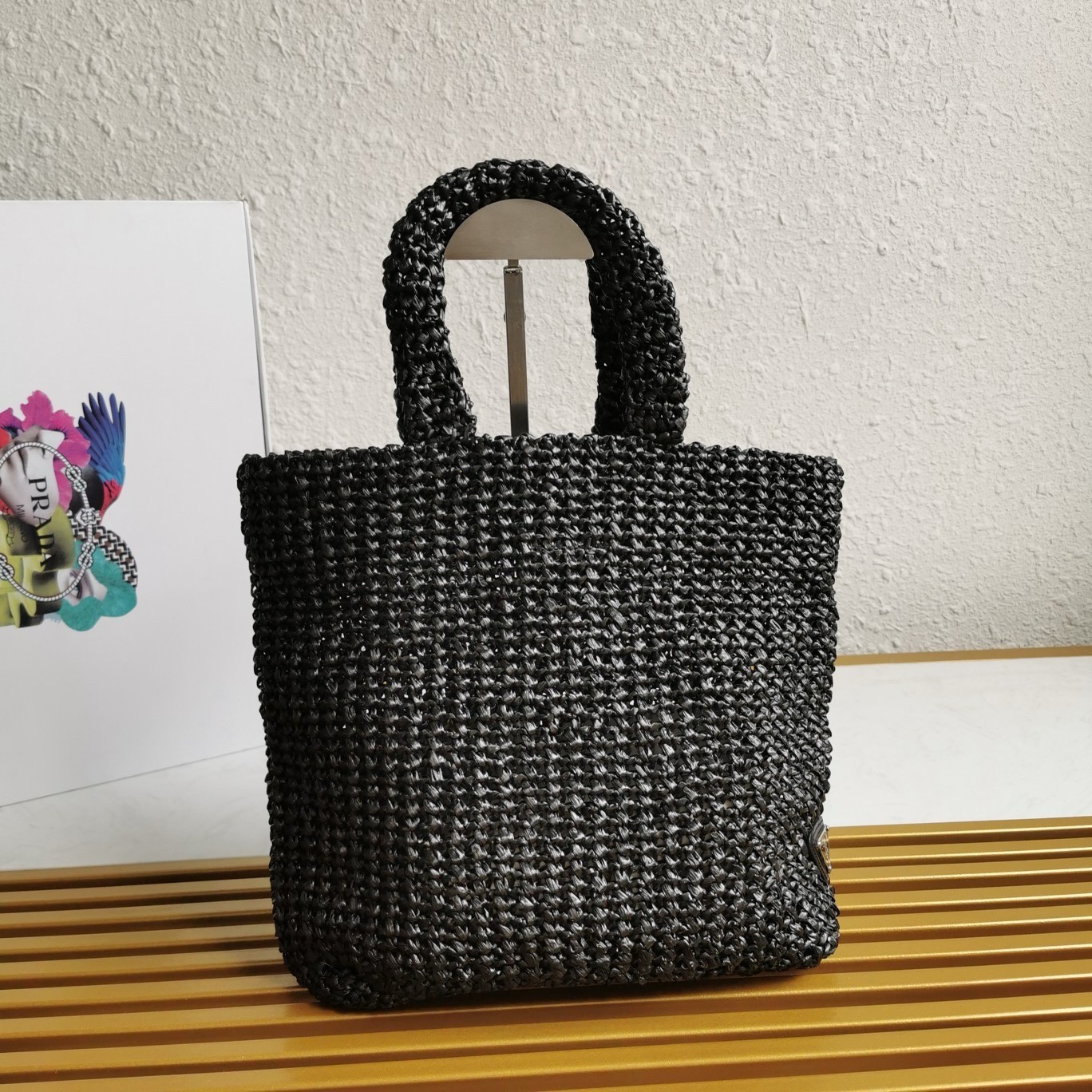 Pra*a small crochet tote bag in black raffia-effect yarn