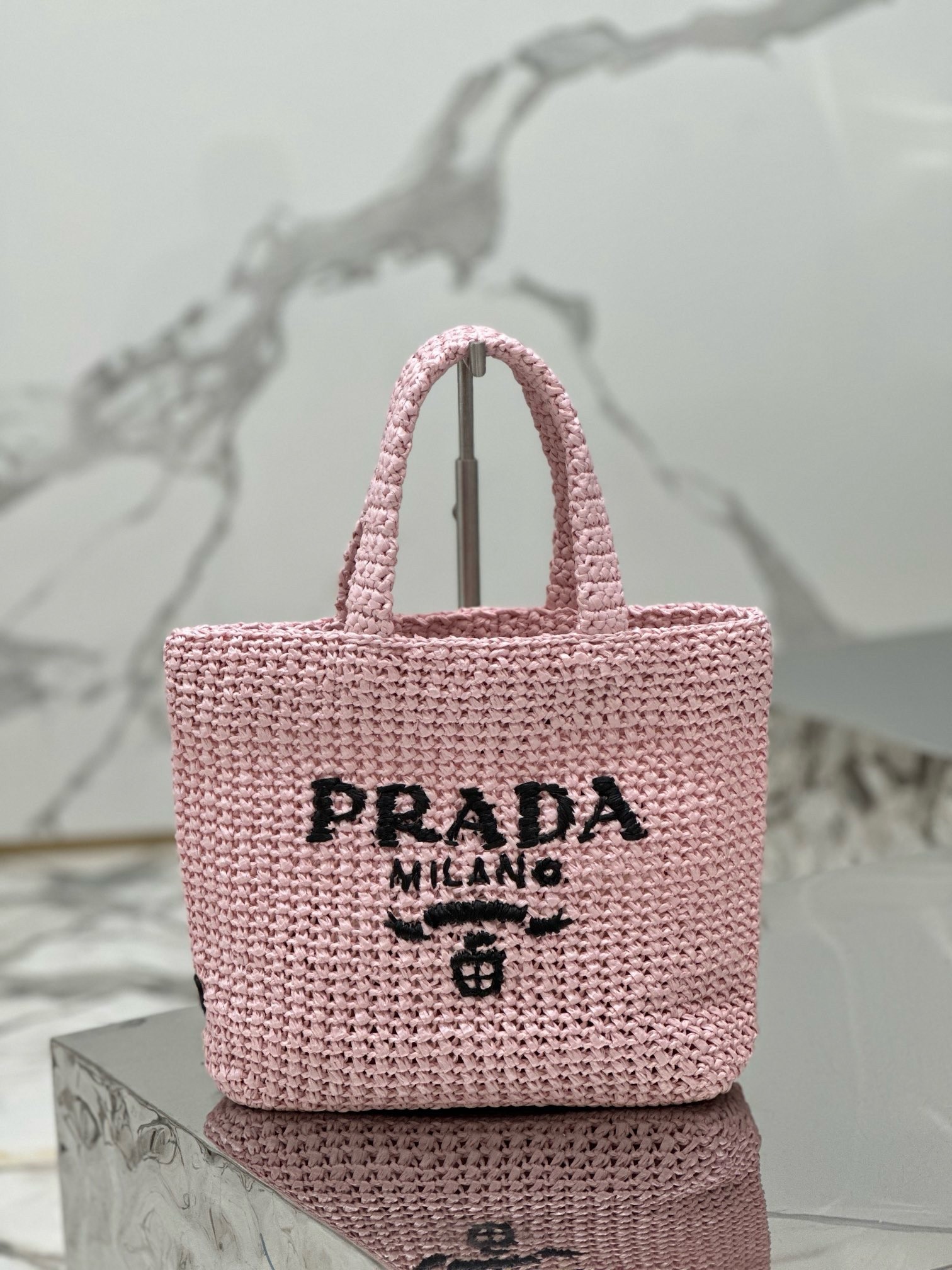 Pra*a small crochet tote bag in pink raffia-effect yarn