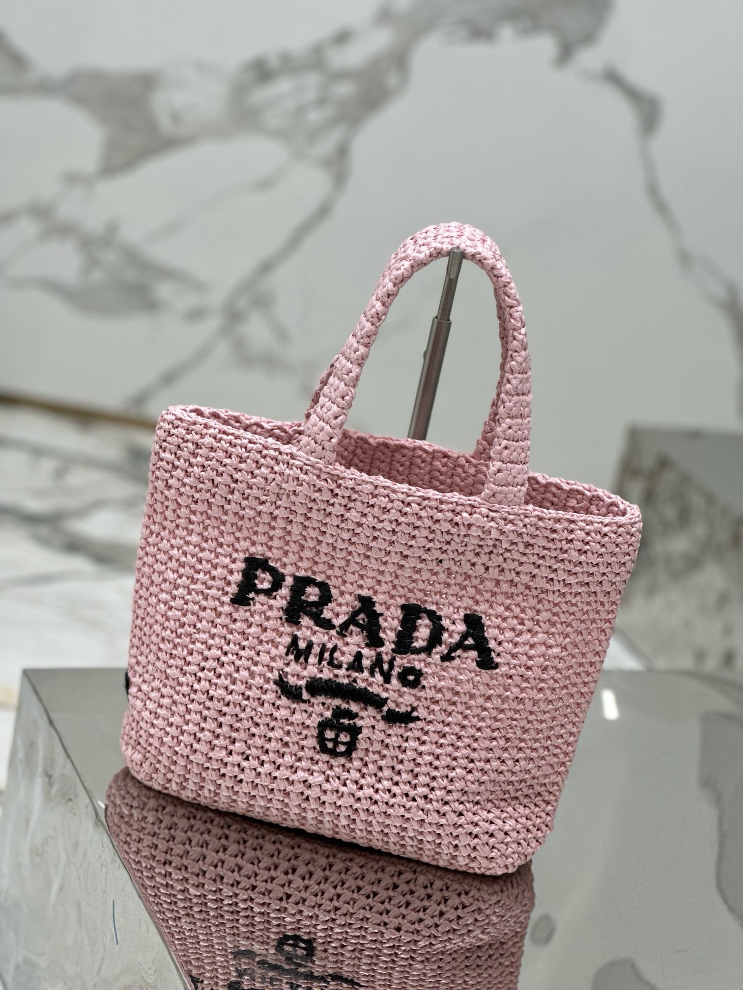 Pra*a small crochet tote bag in pink raffia-effect yarn