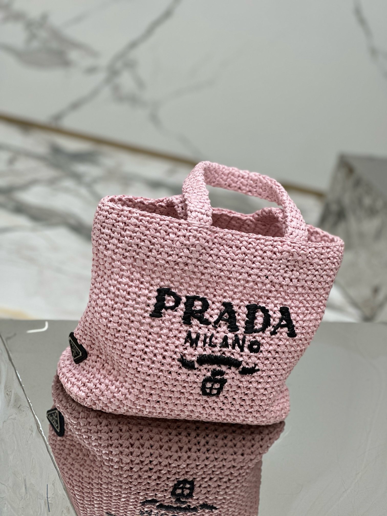 Pra*a small crochet tote bag in pink raffia-effect yarn